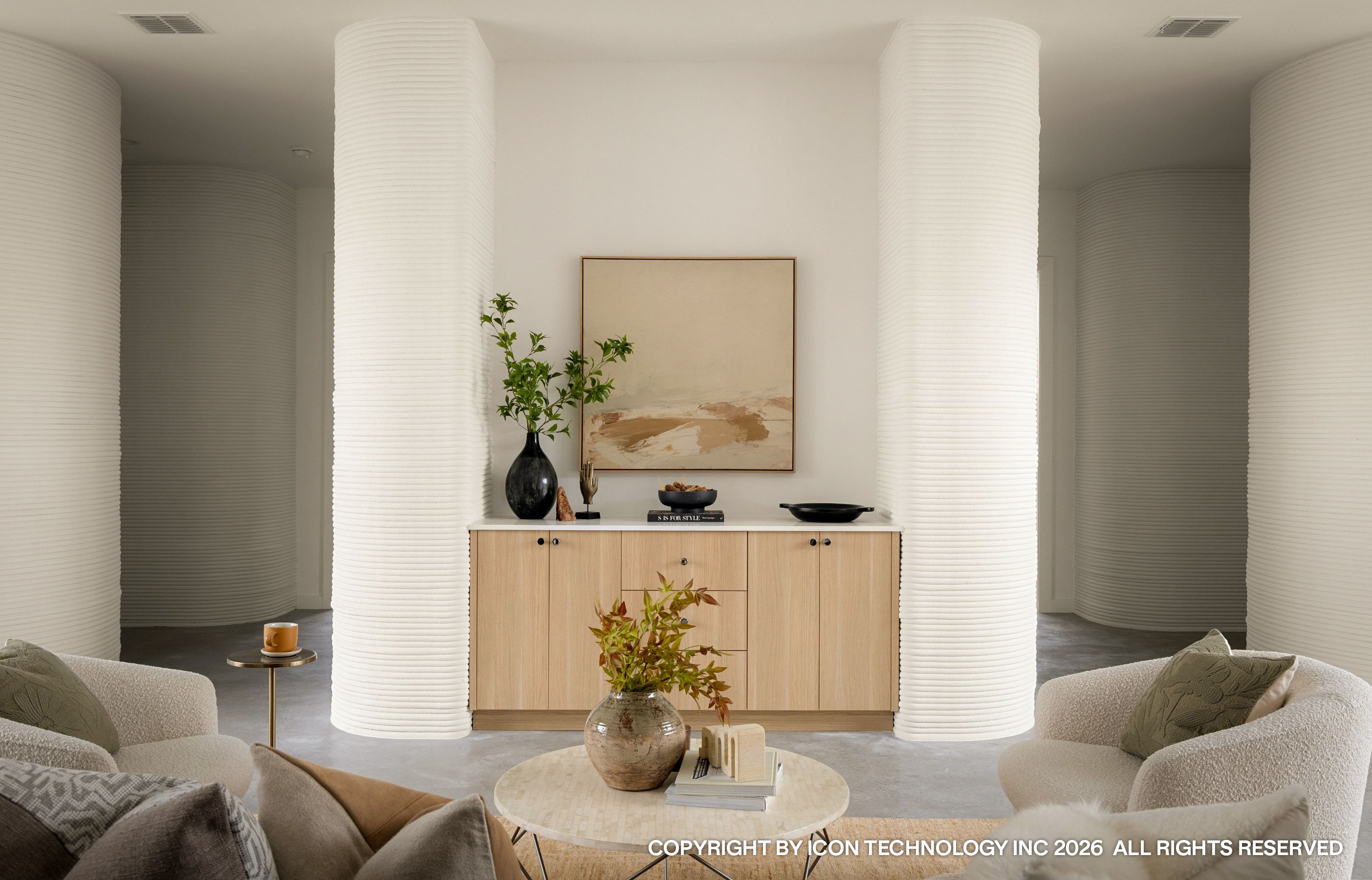 Printed cylindrical columns flanking sideboard and artwork